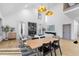 Open concept dining area with light wood table and modern chairs at 113 Laurston Ct, Durham, NC 27712