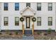 Front entrance with wooden stairs and two wreaths at 113 Laurston Ct, Durham, NC 27712