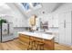 Modern kitchen with island, white cabinets, and skylights at 113 Laurston Ct, Durham, NC 27712