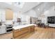 Open concept kitchen with island, white cabinets, and vaulted ceilings at 113 Laurston Ct, Durham, NC 27712