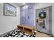 Laundry room with lavender cabinets and geometric floor tile at 113 Laurston Ct, Durham, NC 27712