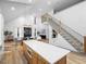 Open concept living room with hardwood floors, a modern fireplace, and large windows at 113 Laurston Ct, Durham, NC 27712