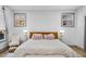 Main bedroom with hardwood floors and a cozy seating area at 113 Laurston Ct, Durham, NC 27712