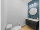 Modern powder room with blue tile and floating vanity at 113 Laurston Ct, Durham, NC 27712