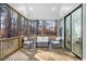 Relaxing screened porch with wooden deck and seating area at 113 Laurston Ct, Durham, NC 27712