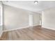 Empty bedroom with hardwood floors, neutral paint, and lots of natural light at 129 Mossy Falls Way, Wendell, NC 27591