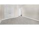 A large bedroom with carpet and double closet doors at 129 Mossy Falls Way, Wendell, NC 27591