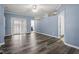 Spacious bedroom with new gray hardwood floors, ceiling fan and access to the bathroom and walk-in closet at 133 John Winstead Rd, Louisburg, NC 27549