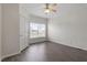 Well-lit bedroom featuring wood-look flooring, and natural light from the window at 133 John Winstead Rd, Louisburg, NC 27549