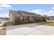 House with a large driveway and access ramp at 133 John Winstead Rd, Louisburg, NC 27549