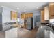 Well-equipped kitchen with stainless steel appliances, wooden cabinets, and granite counters at 133 John Winstead Rd, Louisburg, NC 27549