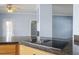 Kitchen cooktop on granite counter with view to adjacent rooms at 133 John Winstead Rd, Louisburg, NC 27549