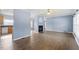 Spacious living room with hardwood floors, natural light, and fireplace at 133 John Winstead Rd, Louisburg, NC 27549