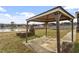 Outdoor patio and grill area overlooking a beautiful lake. An ideal spot for outdoor dining and entertaining at 133 John Winstead Rd, Louisburg, NC 27549