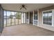 Relaxing screened porch offering a great view, ceiling fan, and access to both the outdoors and indoors at 133 John Winstead Rd, Louisburg, NC 27549