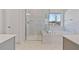 This modern bathroom features a luxurious tub and shower with elegant marble tile at 137 Alderbranch Cir, Garner, NC 27529