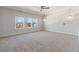 Bright bedroom with a ceiling fan and large window overlooking the backyard at 137 Alderbranch Cir, Garner, NC 27529