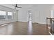 This spacious bonus room boasts hardwood floors, a ceiling fan, and ample natural light at 137 Alderbranch Cir, Garner, NC 27529