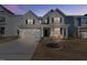 Charming two-story home featuring a covered front porch and a two car garage at 137 Alderbranch Cir, Garner, NC 27529
