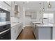 Modern kitchen features stainless steel appliances, island, and granite countertops at 137 Alderbranch Cir, Garner, NC 27529