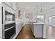 Well-equipped kitchen with stainless steel appliances and modern pendant lighting at 137 Alderbranch Cir, Garner, NC 27529