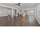 Spacious living room with open floor plan, kitchen access, and hardwood floors at 137 Alderbranch Cir, Garner, NC 27529