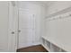 Mudroom area with storage bench, hooks, and white trim at 137 Alderbranch Cir, Garner, NC 27529