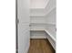 Walk-in pantry with ample shelving and neutral paint at 137 Alderbranch Cir, Garner, NC 27529