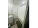 Bathroom with tub shower and modern flooring at 159 Bywood Dr, Roxboro, NC 27573