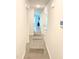 Bright hallway with light gray laminate flooring and doors to other rooms at 159 Bywood Dr, Roxboro, NC 27573