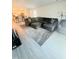 Open living room with a sectional sofa and view of the kitchen at 159 Bywood Dr, Roxboro, NC 27573