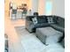 Open living room with gray sectional sofa and kitchen view at 159 Bywood Dr, Roxboro, NC 27573