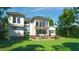 Lush backyard featuring a wood deck, a manicured lawn, and mature trees at 180 Bur Oak Ct, Pittsboro, NC 27312