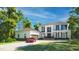 Stunning two-story home featuring a private driveway, black framed windows and a two-car garage at 180 Bur Oak Ct, Pittsboro, NC 27312