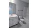 Bright bathroom featuring a white vanity, toilet, and tub/shower combination at 203 Broomgrove Way, Wake Forest, NC 27587