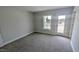 Neutral bedroom with carpet and a door to a balcony at 203 Broomgrove Way, Wake Forest, NC 27587