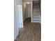 Entryway with wood floors and stairs leading up to the second floor at 203 Broomgrove Way, Wake Forest, NC 27587