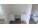 Bright office nook with custom desk, cabinets, and hardwood floors at 203 Broomgrove Way, Wake Forest, NC 27587