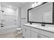 Bathroom featuring double vanity with marble countertop and a shower over tub at 2094 Harris Farm Ct, Burlington, NC 27215