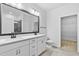 Elegant bathroom features double vanity with marble countertop, and a large framed mirror at 2094 Harris Farm Ct, Burlington, NC 27215
