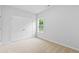 Bedroom with double door closet featuring a window with a view of the outside at 2094 Harris Farm Ct, Burlington, NC 27215