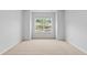 Bright, spacious bedroom with a large window view of the neighborhood at 2094 Harris Farm Ct, Burlington, NC 27215
