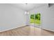 Bright dining area with sliding glass doors and wood laminate flooring provides access to the outside at 2094 Harris Farm Ct, Burlington, NC 27215