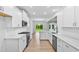 Spacious kitchen featuring stainless appliances, white cabinets, and an open design to the backyard at 2094 Harris Farm Ct, Burlington, NC 27215