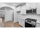 A beautifully designed kitchen showcases stainless steel appliances and stylish white cabinetry at 2094 Harris Farm Ct, Burlington, NC 27215