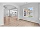Open concept living area with hardwood floors, access to a modern kitchen and large window at 2094 Harris Farm Ct, Burlington, NC 27215