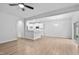 Bright open concept living room features hardwood floors, slider door to backyard, and eat-in kitchen at 2094 Harris Farm Ct, Burlington, NC 27215