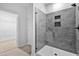 Modern shower features gray tiling, glass surround, and recessed storage niche at 2094 Harris Farm Ct, Burlington, NC 27215