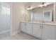 Elegant bathroom with double vanity, granite countertop, and sleek fixtures at 2117 Treelight Way, Wendell, NC 27591