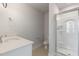 This bathroom features a single sink vanity and glass enclosed shower at 2117 Treelight Way, Wendell, NC 27591